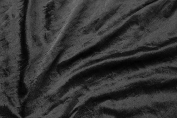 istock Abstract black fabric cloth texture background or liquid wave or wavy folds 1218321678