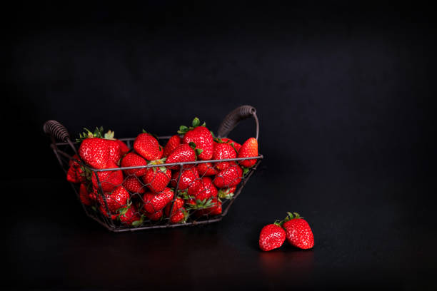 istock A basket full of fresh strawberries on a dark background 1218329033