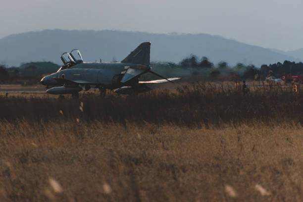 istock Military air base at sunset 1218333292