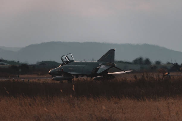 istock Military air base at sunset 1218333315