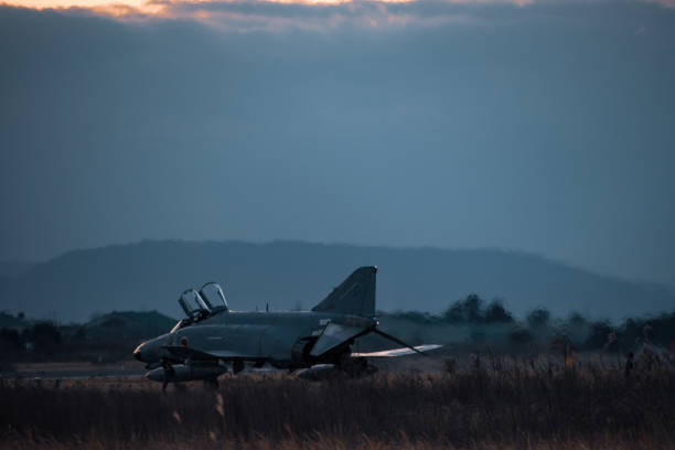 istock Military air base at sunset 1218333325