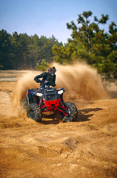istock Racing in the sand on a four-wheel drive quad. 1218334663