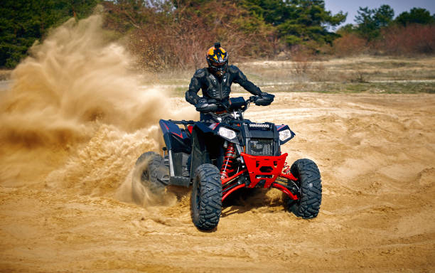 istock Racing in the sand on a four-wheel drive quad. 1218334666