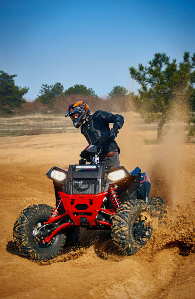 istock Racing in the sand on a four-wheel drive quad. 1218334667