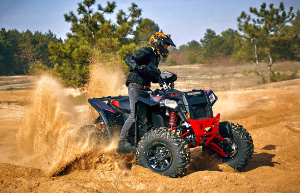 istock Racing in the sand on a four-wheel drive quad. 1218334668
