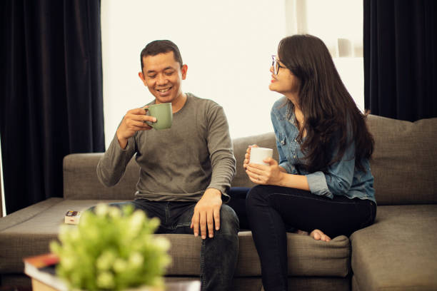istock Couple relaxing on sofa in their new home 1218335542