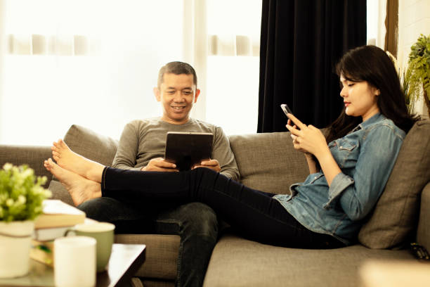 istock Couple relaxing on sofa in their new home 1218335593