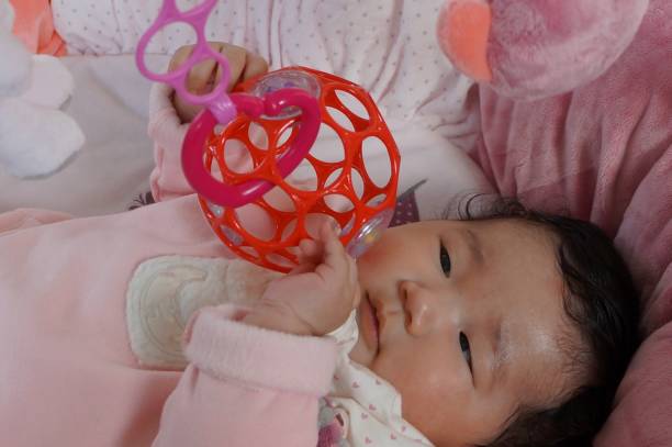 baby playing with O'ball 3 month old baby playing with O'ball. 0 1 months stock pictures, royalty-free photos & images