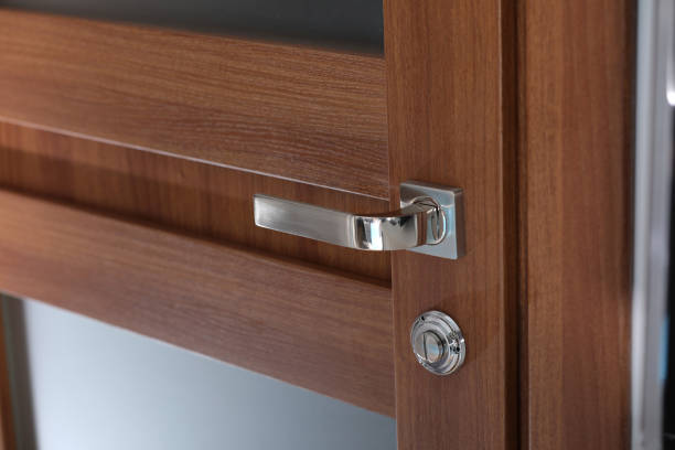 istock modern style door handle on natural wooden door. selective focus 1218336497