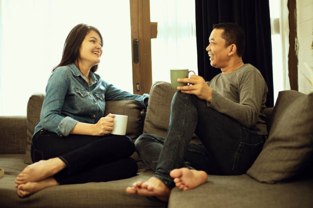istock Couple relaxing on sofa in their new home 1218337745
