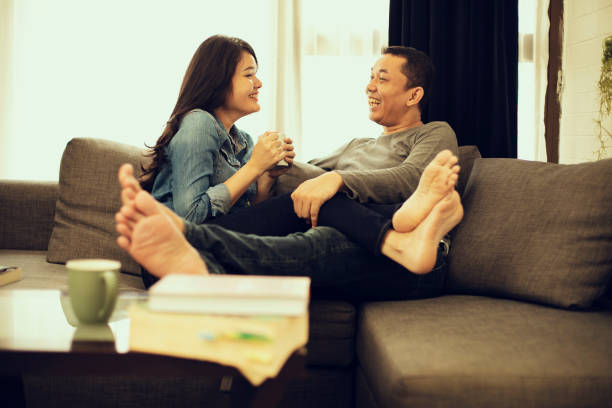 istock Couple relaxing on sofa in their new home 1218337901