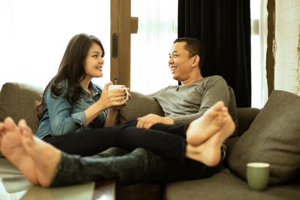istock Couple relaxing on sofa in their new home 1218337905