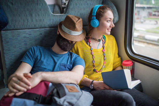 istock Young couple traveling by train 1218341695