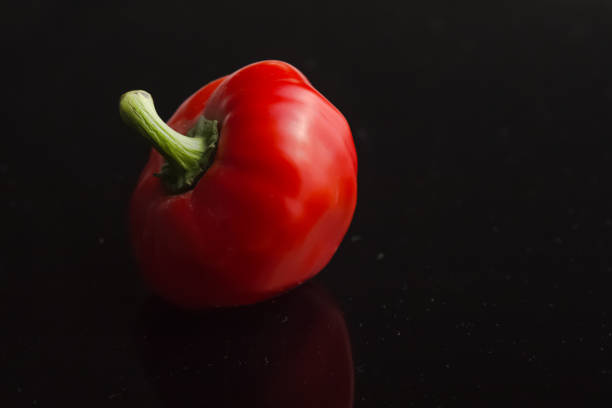 red pepper paprica isolated on black background. Top view