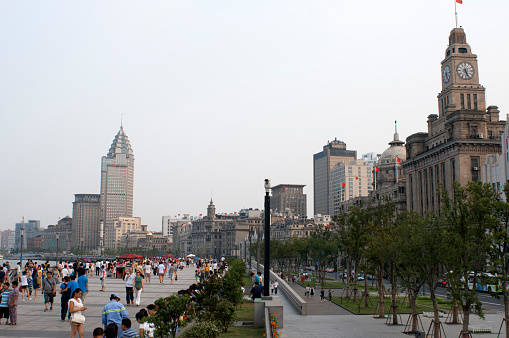 The Bund promenade, Shanghai, China. China Shanghai Tourist Shanghai Skyline viewed over the Huangpu river from the Bund. Bin Jiang Avenue, The Bund, Shanghai, China. The highlights of the Bund are undoubtedly the colonial-era buildings lining the west side of Zhongshan Dong Yi Lu, standouts of which include the former British Consulate, Customs House, former Hong Kong and Shanghai Bank, former Shanghai Club (now the Waldorf Astoria Hotel), and the Peace Hotel. For more details on these buildings, many of which have been skillfully restored, and a more complete walking guide to this gallery of European architecture.