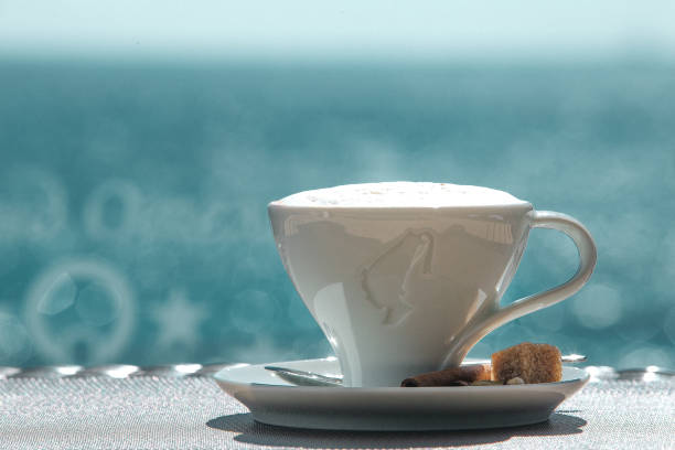 istock A cup of coffee with blue sea views 1218347545