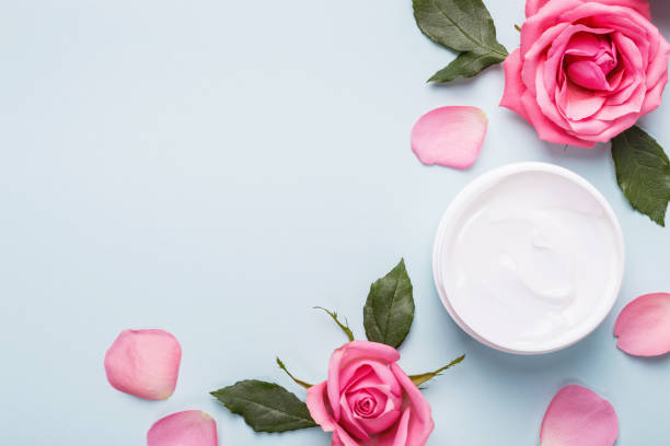 Natural Cosmetics cream. Organic Skin care product, rose buds and petals. Flat lay image, copy space Natural Cosmetics cream. Organic Skin care product, rose buds and petals. Flat lay image, copy space. rose colored photos stock pictures, royalty-free photos & images