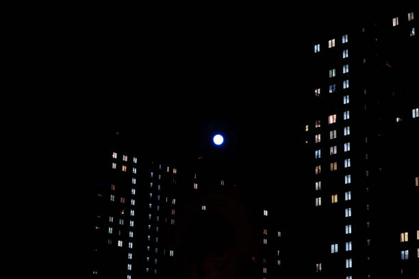 istock full moon between two high-rise buildings 1218349466