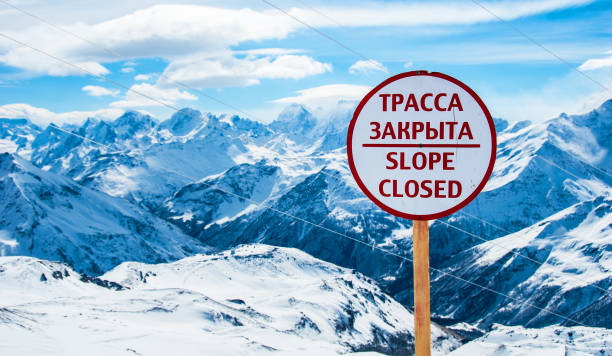 Avalanche warning sign on high mountains ski resort. stock photo
