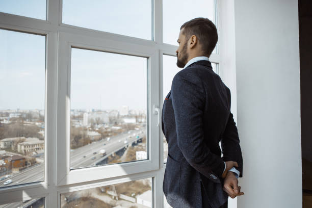 istock Businessman Near Window in Office 1218354094