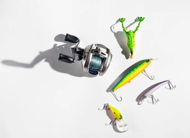 Photo of jerkeys spinning and multiplier reel for fishing on a white background close-up