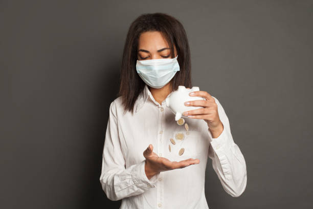 financial crisis and pandemic concept. young black woman in medical mack without money - flu virus cold and flu swine flu epidemic imagens e fotografias de stock