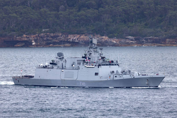 INS Sahyadri (F49) Shivalik-class stealth multi-role frigate of the Indian Navy departing Sydney Harbor. Sydney, Australia - October 11, 2013: INS Sahyadri (F49) Shivalik-class stealth multi-role frigate of the Indian Navy departing Sydney Harbor. indian navy stock pictures, royalty-free photos & images