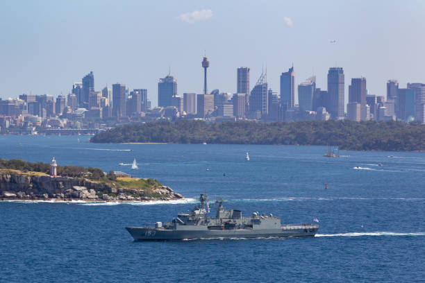 HMAS Stuart (FFH 153) Anzac-class frigate of the Royal Australian Navy departing Sydney Harbor. Sydney, Australia - October 11, 2013: HMAS Stuart (FFH 153) Anzac-class frigate of the Royal Australian Navy departing Sydney Harbor. australian navy stock pictures, royalty-free photos & images