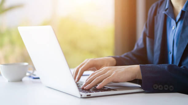 istock Businessman or accountant working on laptop computer with business document, business financial accounting concept. 1218359181