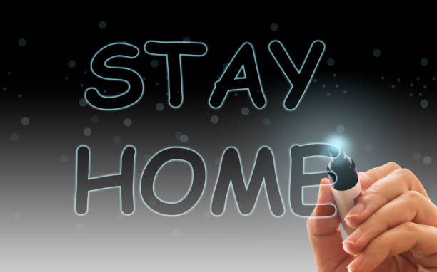 istock Inscription stay at home. Outbreak Warning. written white chalk on blackboard in connection with epidemic of coronavirus worldwide 1218360948