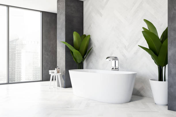 istock Wooden and gray bathroom corner with tub 1218361803