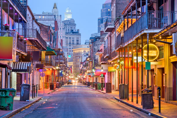Bourbon Street, New Orleans, Louisiana Bourbon St, New Orleans, Louisiana, USA cityscape of bars and restaurants at twilight. new orleans photos stock pictures, royalty-free photos & images