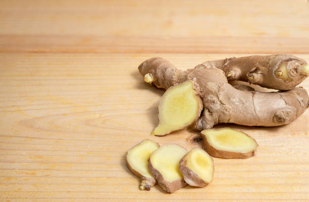 istock Fresh gingers  on wood background 1218362533