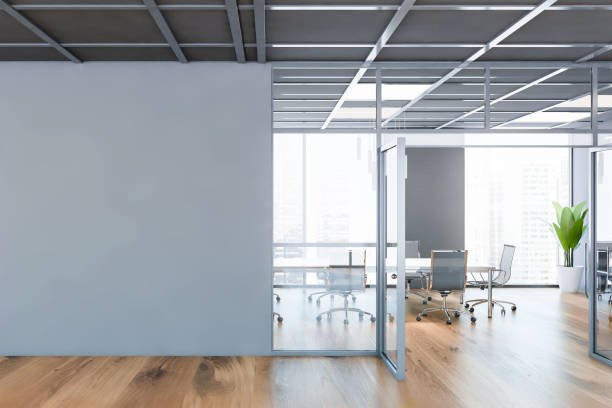 istock Grey conference room interior with mock up wall 1218363875