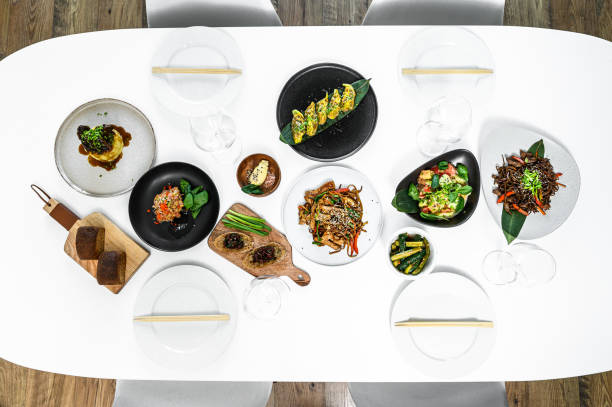istock Assorted Chinese food set. Noodles, fried rice, dumplings, peking duck, dim sum, spring rolls. Famous dishes on table.  Gray background. Top view. 1218364095