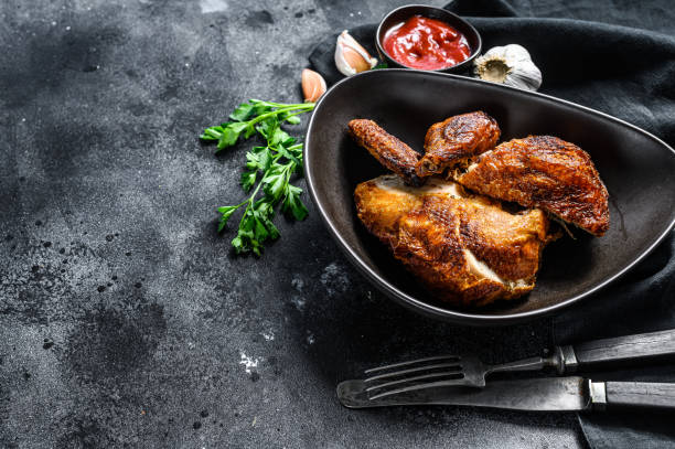istock Peking style fried chicken. Black background. Top view. Copy space 1218364231