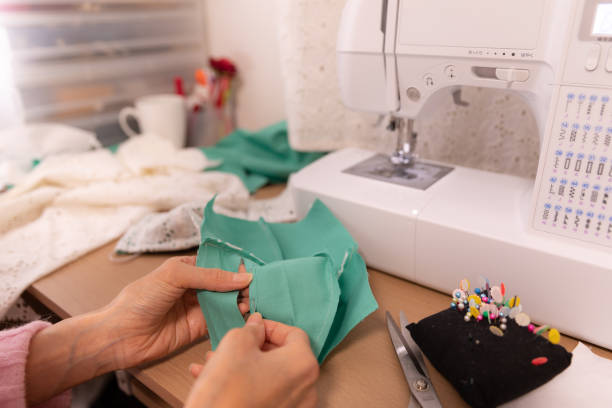 istock Japanese woman making mask at home 1218365008