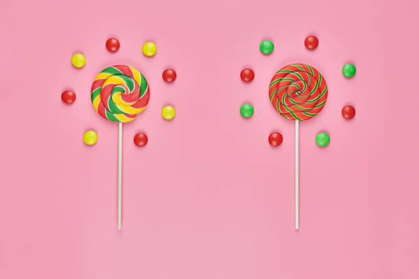 istock Sweet lollipops and candy on pink background 1218365104