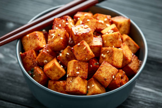 istock Fried Tofu in a bowl with chopstick and sesame seeds 1218365346