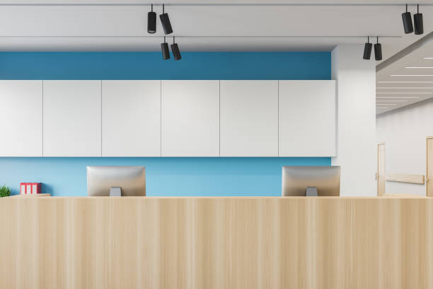 istock Reception desk in white and blue hospital close up 1218366425