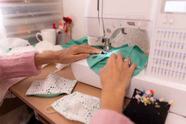 istock Japanese woman making mask at home 1218366579