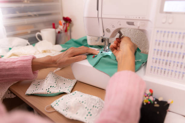 istock Japanese woman making mask at home 1218366770