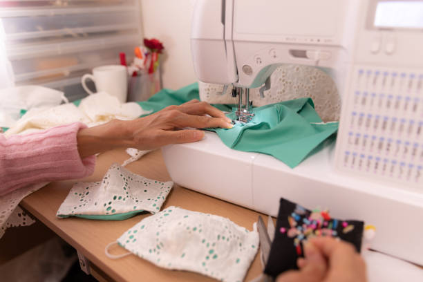 istock Japanese woman making mask at home 1218366993