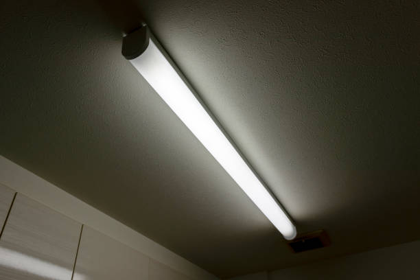 istock Light illuminating a dark room from the ceiling 1218367745