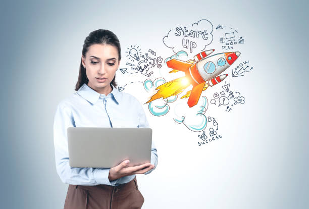 istock Woman with laptop and her startup project 1218367959
