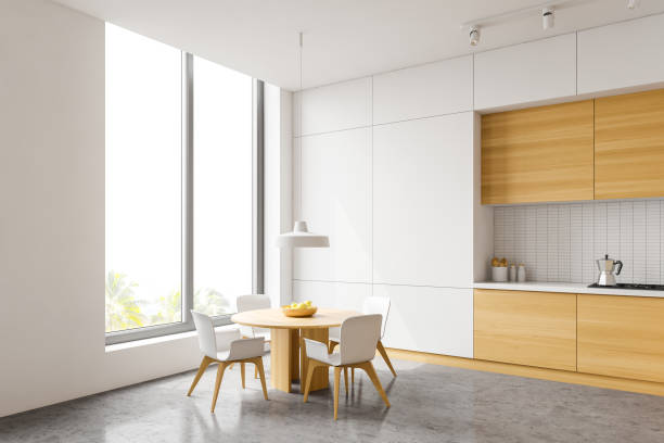 istock White and wood kitchen corner, table and window 1218368179