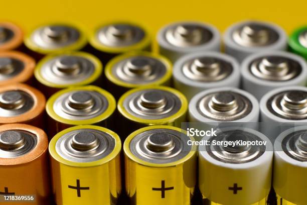Closeup Of A Lot Of Color Aa Batteries Stock Photo - Download Image Now - Battery, Alcoholics Anonymous, Alkaline