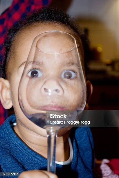 Beautiful Large Eyes Behind A Wine Glass Stock Photo - Download Image Now - Child, Christmas, African-American Ethnicity
