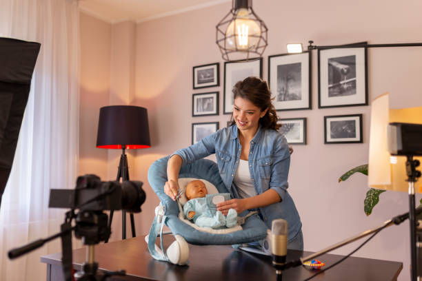 istock Vlogger making video about use of newborn baby rocker for sleeping 1218372282