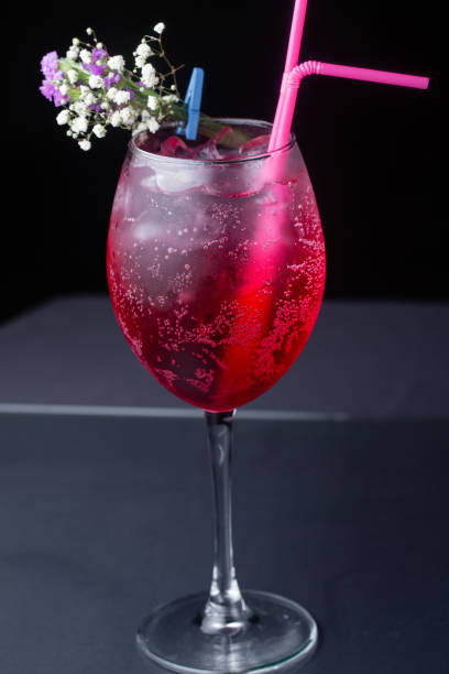 istock red refreshing alcoholic cocktail made from cherry juice decorated with mint and flowers 1218372489